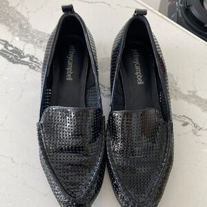 Jeffrey Campbell patent loafers within studded heel.